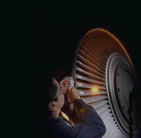 Quality inspector examining a turbine component