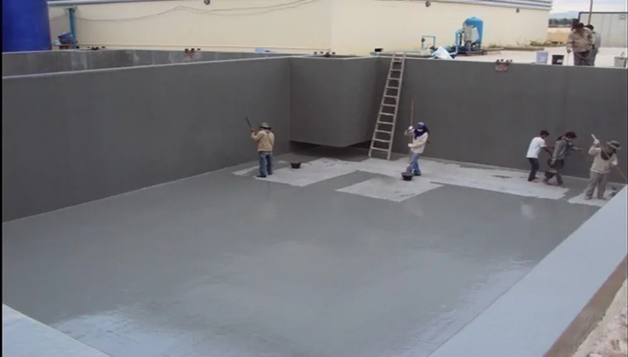 Workers applying FRP lining inside a tank